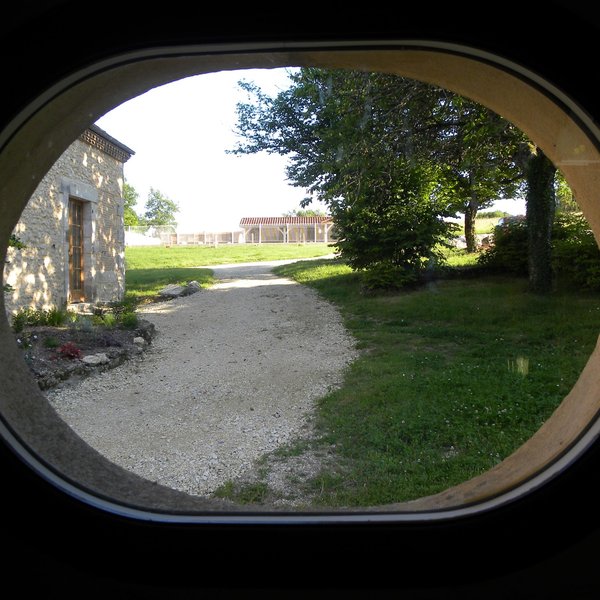 View through farmhouse 'cows eye' window