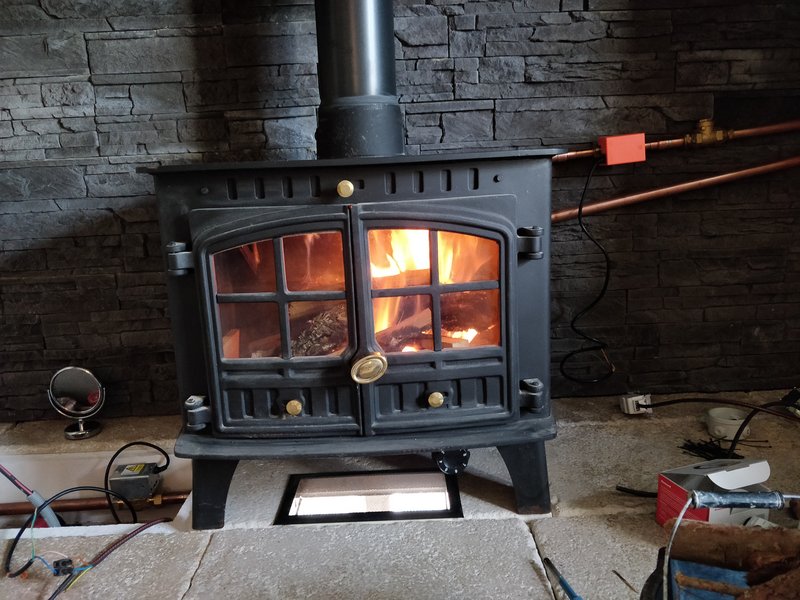 A wood burner heats the water and the house extremely efficiently.